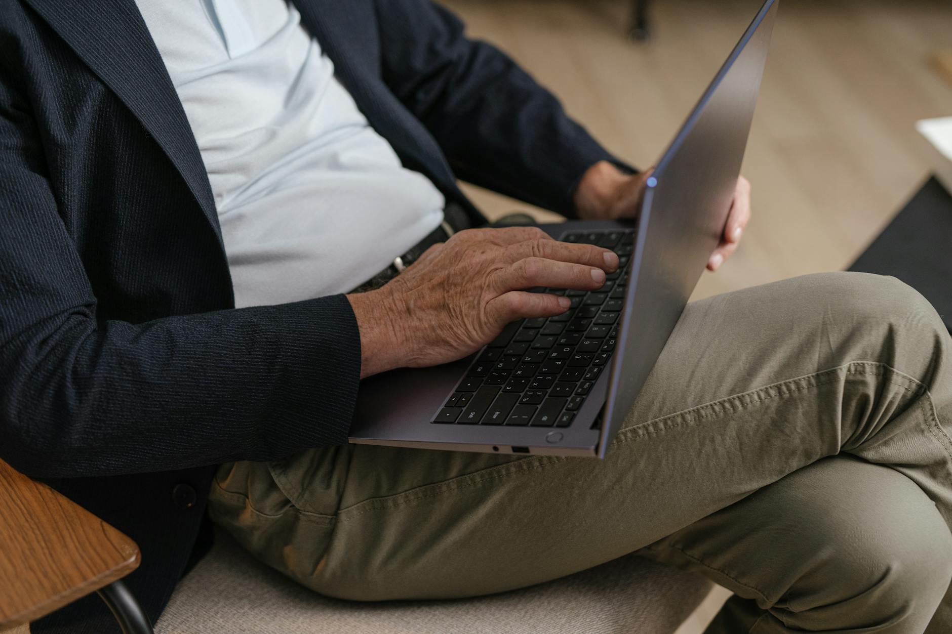 Adult working on a laptop while sitting comfortably indoors, focused on a task — illustrating: Which email security service actually protects families without breaking the bank?