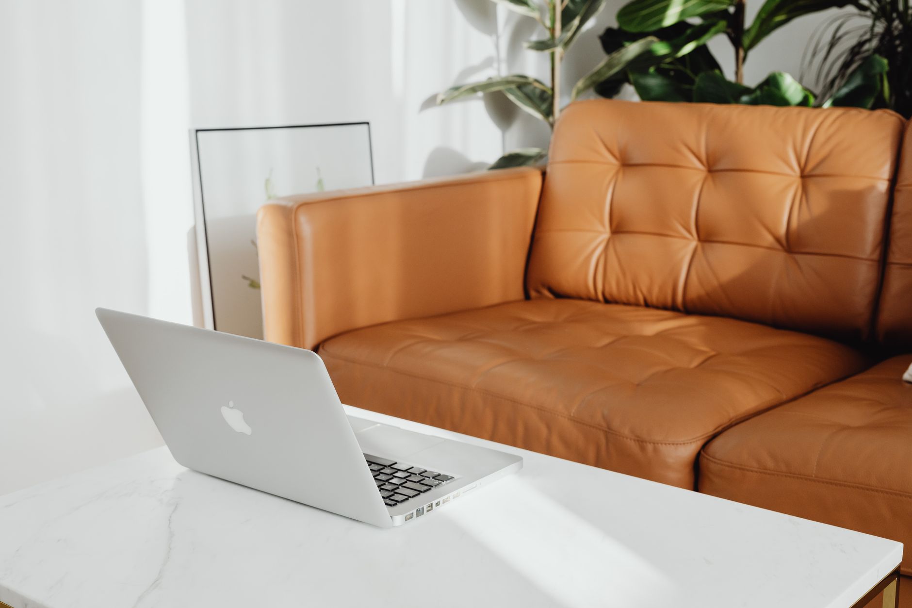 A cozy living room with a laptop on the coffee table, perfect for relaxation — illustrating: Free vs. paid photo editing software: which tools are actually worth it for home use?